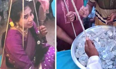 নাতনিকে পাল্লায় তুলে সমান ওজনের ধাতব মুদ্রা উপহার দিলেন নানা